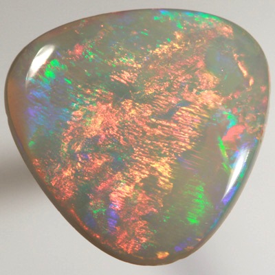 SOLID SEMI BLACK OPAL Large rolling flashes of neon red over green SEE VIDEO  